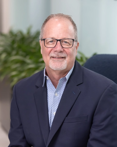 portrait of a smiling person in professional attire